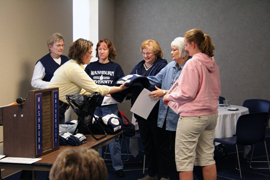 Biggest losers Becky Wilber, SRWC assistant director, awards the winning team members of the Resolution Solution with their prizes. The Registrar Rascals were Karen Travis, Jane Stewart, Judy McCourt, Amber Traphagan and Carla Rasch
