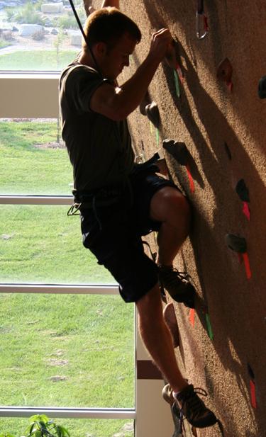 Climbing the challenge Johnathon Blake tackles the climbing wall at the Student Recreation and Wellness Center, which is running the Resolution Solution program to help students and faculty reach their goals for the new year.
