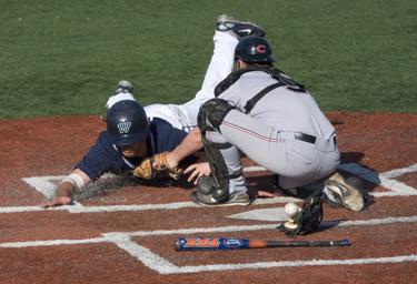 Luis Beltran Lopez slides in for a run against Central Missouri. The Bods had no trouble scoring in the series, but went 1-3 against the Mules last weekend.
