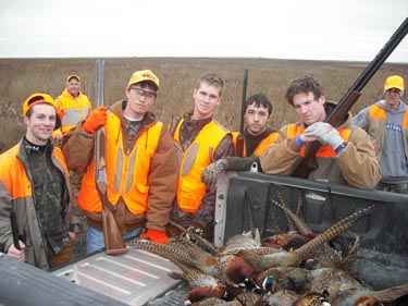 Bod blasters (Left to right) Washburn students Michael Glass and Garrett Love and graduates Tim Mathias, Charlie Ross and Reed Howard pose after a successful opening day of pheasant hunting afield in Montezuma.
