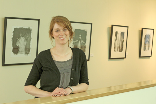 A portrait of self Deedra Baker displays her work in the John R. Adams Gallery of the Washburn art building. Baker’s artwork attempts to question what being a female means in modern society, among other topics.
