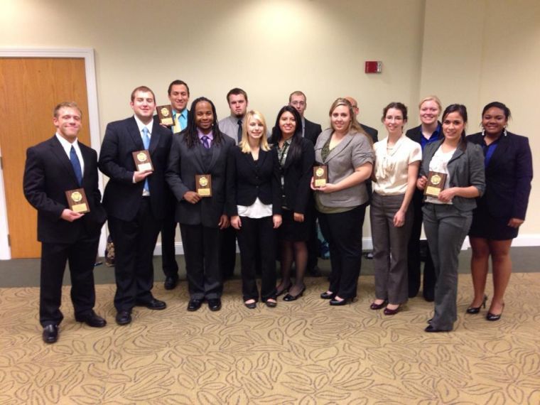Washburns Mock Trial students pose for a photo with their awards Oct. 20, 2012. Their competition took place at Northwest Missouri State, but the team travels across the country to compete.
