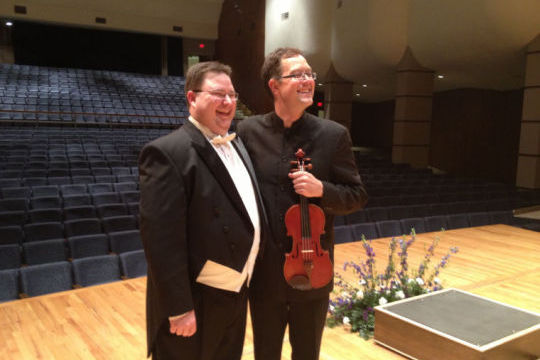 Chris Kelts and Brian Lewis stand together after their performance at White Concert Hall on Saturday. Kelts is one of five final conductors on the list to take over the conductor and music director for the Topeka Symphony Orchestra

