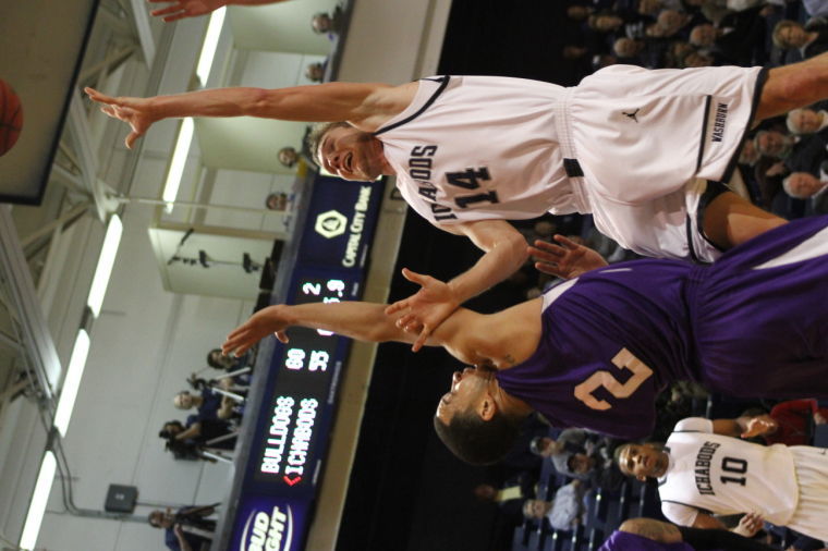Washburn's Christian Ulsaker tries to finish at the hole against a defender earlier this season.
