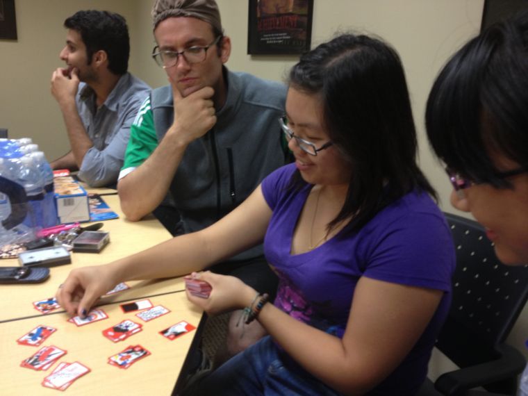 Andy Vogel, a liberal studies grad student, and Teresa Chiu, a senior majoring in biology and chemistry, play the Korean card game, Stop-Go. The game itself is being played with Japanese hanafuda cards.