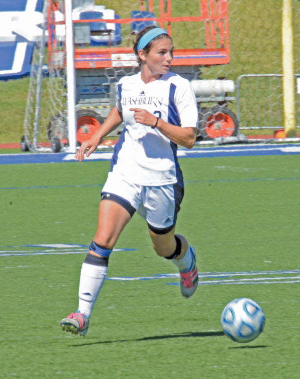 Taylor Mayhew, senior defender, runs for the ball. Mayhew made an impressive score in minute 52 of the game.