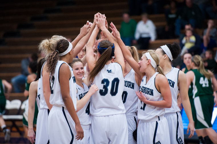 The team celebrates their win against the Bearcats. The team beat the Bearcats 73-55.
