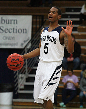 Junior guard, Korey Fisher, brings the ball down the court. 