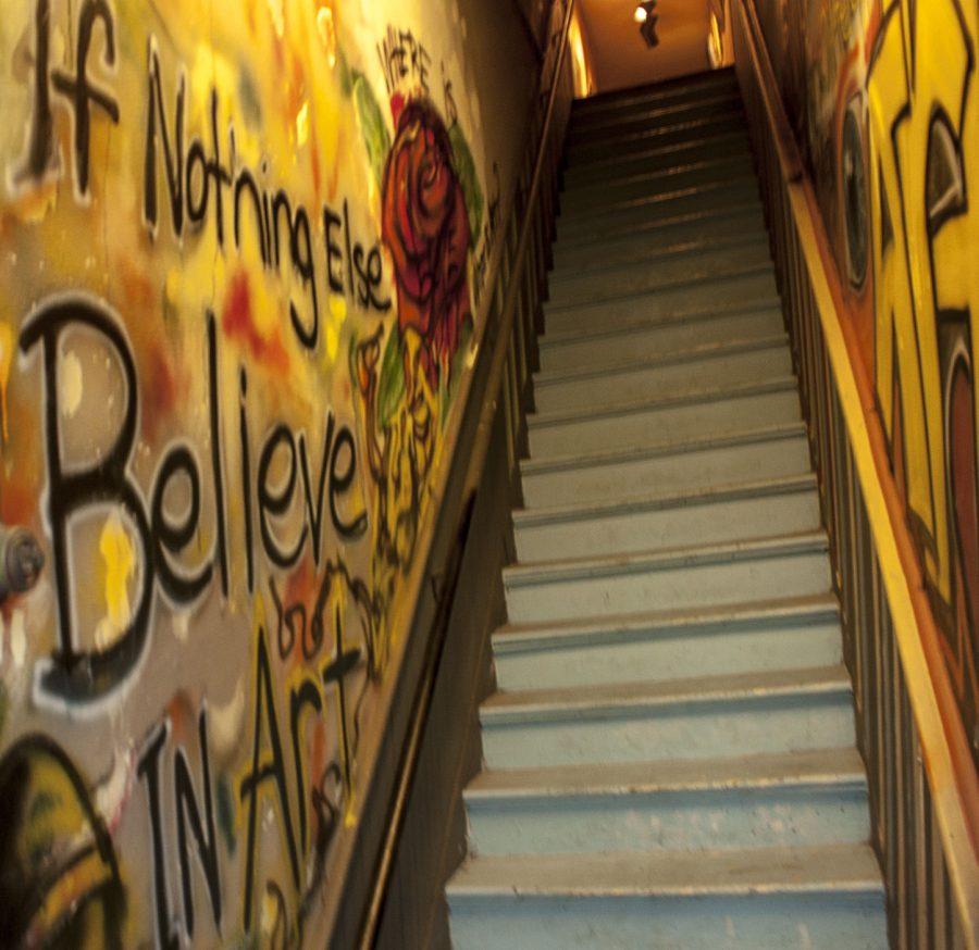The stairs leading up to Two Wolves Studio & Artist Den provide a sneak peek at the diverse array of artwork inside the gallery. Members of the Two Wolves Collective will be showcased at this months First Friday Artwalk. Two Wolves is located at 837 1/2 N. Kansas Ave., in the NOTO Arts District.
