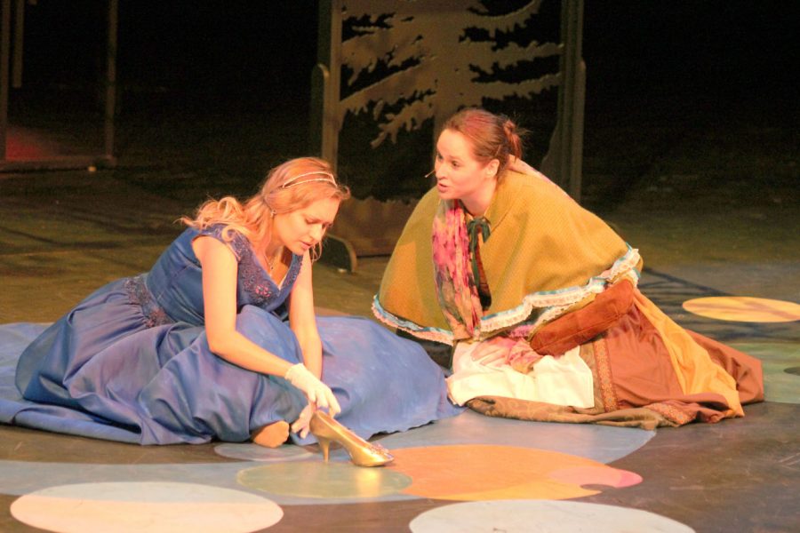 Cinderella (Anna Tague) and the Baker’s Wife (Allison Ralstin) discuss Cinderella’s trip to the Festival while the Baker’s Wife tries to steal Cinderella’s shoe to lift the curse on her family. 