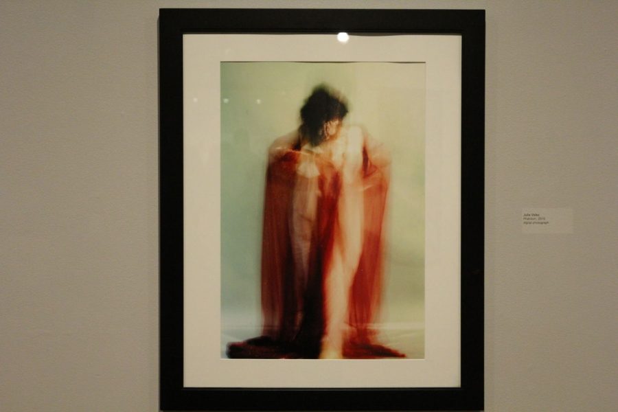 Senior art major Julie Velez has one photograph in the Mulvane Art Museum for display. This is a photograph of a model covered in glitter that appears to look like a phantom.