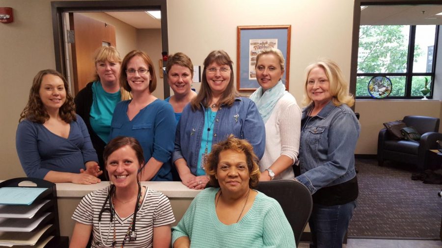 Student Health employees embracing Denim Day include (front) Samantha Chitwood APRN and Evelyn Brown; (middle) Crystal Leming LMLP, Jamie Olsen LPP, Kim Fletcher, Tiffany McManis APRN and Pat Wilden R.N.; (back) Sheri Lagrand-Aulich, intern, Shirley Dinkel, Ph.D., APRN-BC Director Student Health.
