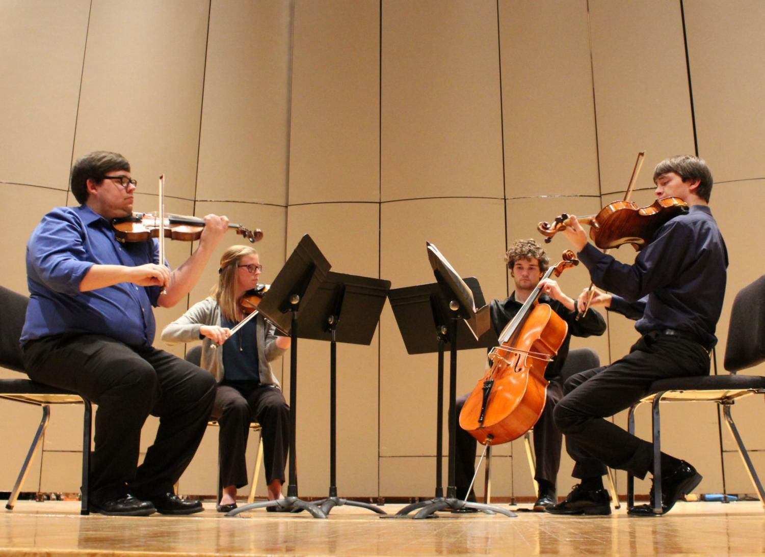 Strings: Ryan Masotto and Samantha Silver perform with the other members of the Fetter String Quartet in their November recital. Alongside their work in the Quartet, the two also play in solo recitals and teach viola and violin lessons to any wanting to learn.