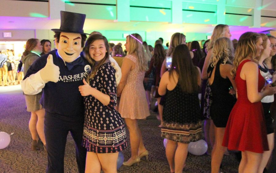 Having A Ball: Sydney Masters, freshman social work major, poses in the middle of the dance floor at the Homecoming Ball. The ball was  at 7 p.m. Oct. 24 in the Washburn A/B Room, featuring royalty as elected by the student body prior to the dance.