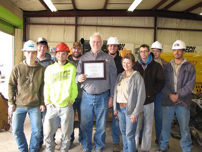 Instructor Michael Evenson and his class pose with his award. Evenson is the first faculty member from Washburn Tech to win the award.
