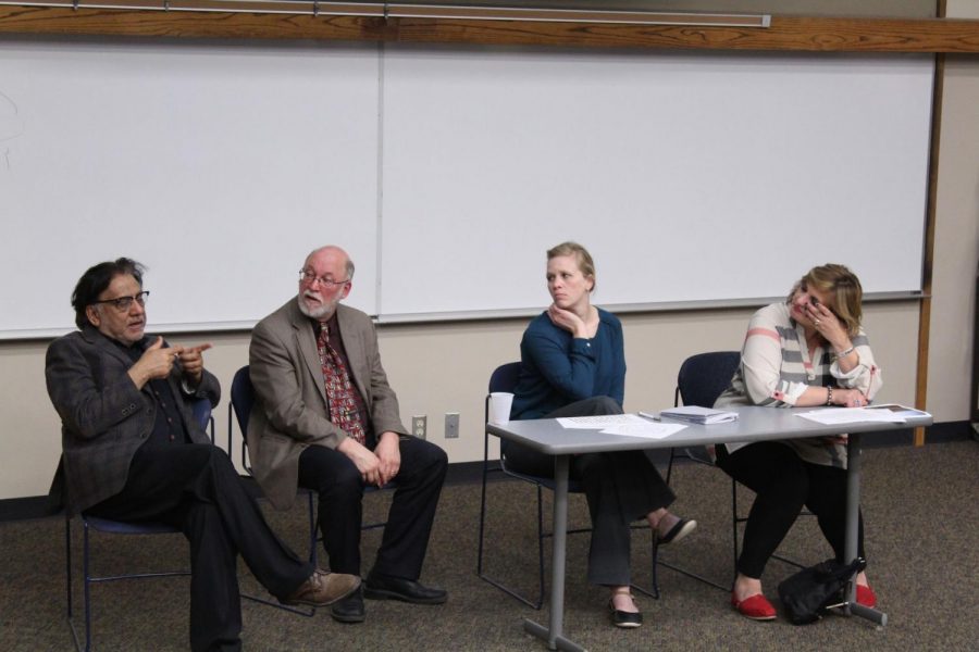Speaking on Syria: Professor of law Ali Khan (left), history chair Tom Prasch, assistant professor of political science Linsey Moddelmog and associate professor of social work Bassima Schbley discuss the Syrian civil war.