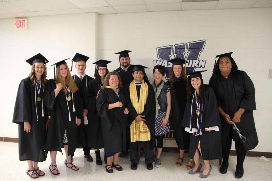 Fine arts students, Amber Coultis, Ryan Johnson, Shawn Rooks, Christina Lynn Garcia, Megan Barnes and Cassandra Leigh await commencement with art faculty, Marguerite Perret,  Azyz Sharafy, Kelly Watt and Monette Mark.