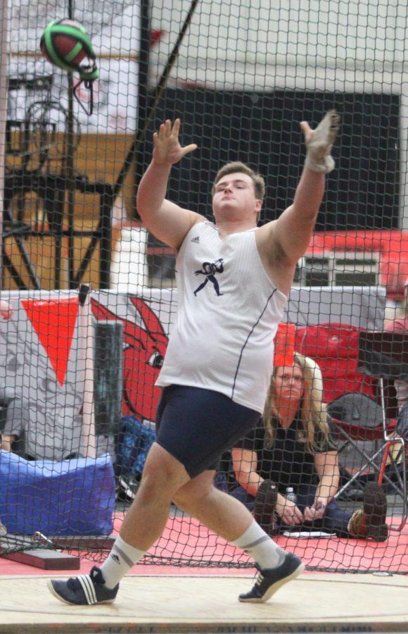 Michael Majors competing in shot put. Majors is a sophomore planning to major in business.
