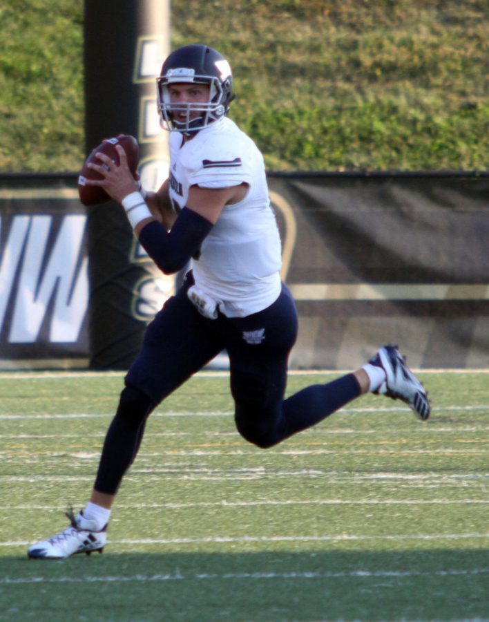 Sophomore quarterback Blake Peterson rolls out looking for a receiver in Washburn’s 26-16 win over Lindenwood Saturday night in St. Charles, Missouri.