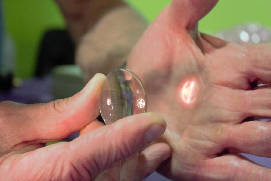 Let there be light: Dr Chris Orensen demonstrates how light can be manipulated by lenses.