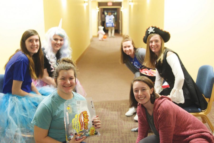 Trick-or-treaters in residence halls get candy, give cans
