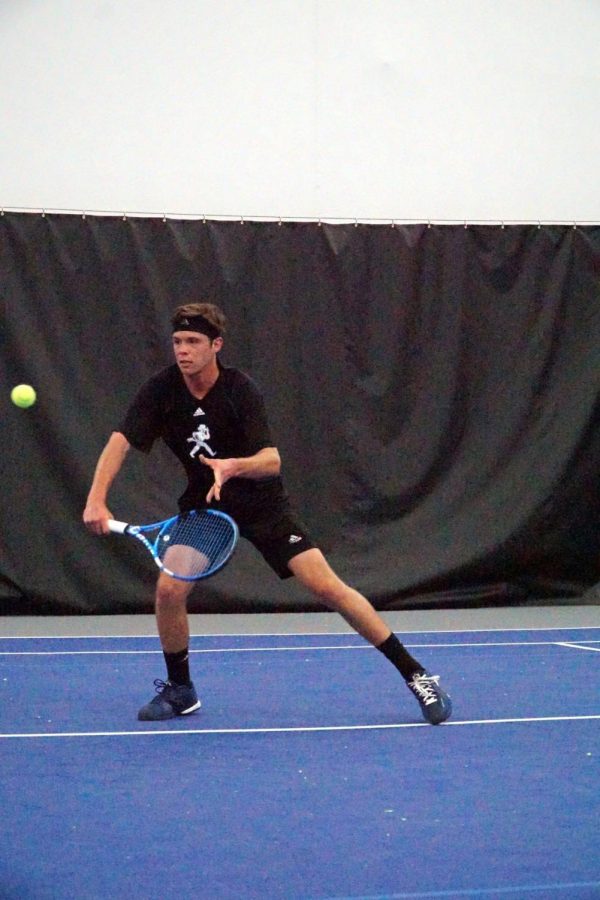 Freshman+Bradley+Eidenmueller+slices+a+volley+during+his+singles+match+against+the+Southwest+Baptist+Bearcats.