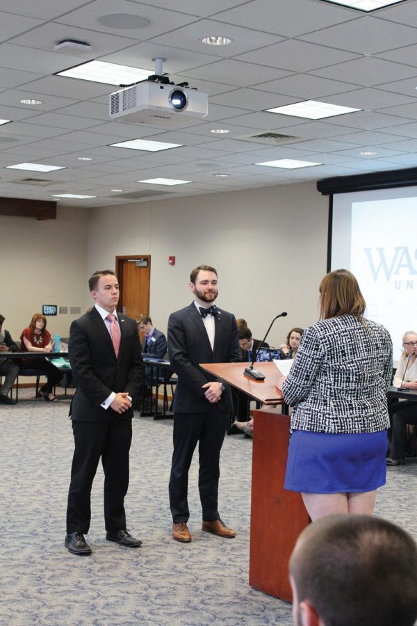 New leadership: WSGA faculty adviser Jessica Barraclough swears in Jim Henry and Zac Surritt as WSGA vice president and president at the April 18 meeting. Surritt and Henry were elected to their positions during the March elections.