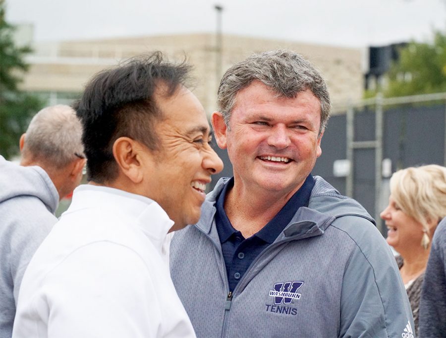 Good Times: Assistant coach David Price (right) mingles with alumni and old friends during the dedication of the newly completed tennis complex. 