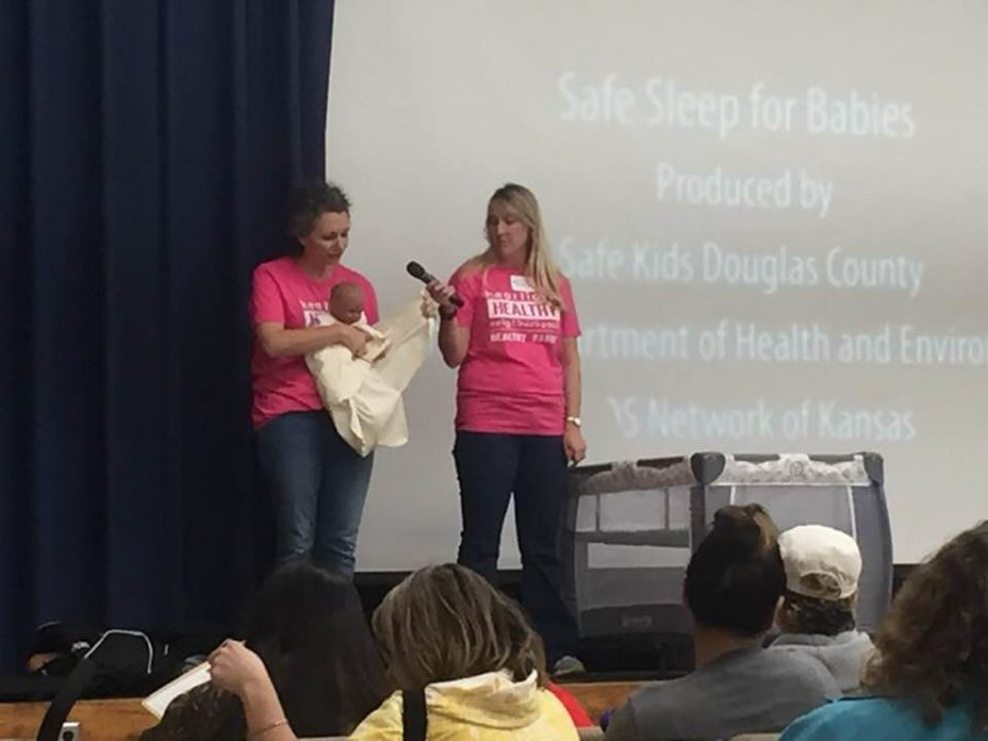 Rock-a-bye baby: Safe sleep experts demonstrate the correct way to use a sleep sack. The annual community baby shower was at Topeka’s CRC Care Center.