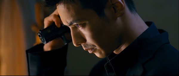 Bad to The Bone: 'The Man from Nowhere's protagonist Cha Tae-sik inspects a handgun for future use. Pictured is Won Bin, who portrays Cha Tae-sik with perfection.