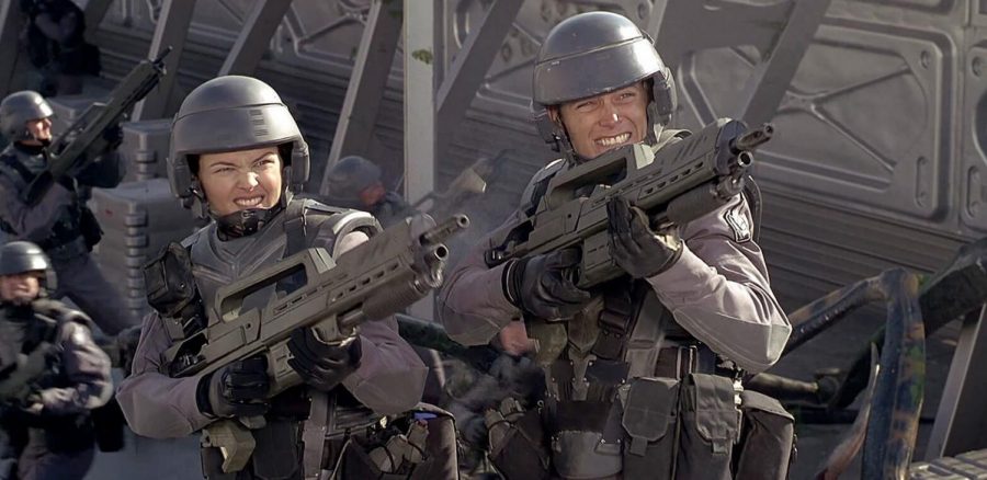 Insect Repellent: Paul Verhoevens Starship Troopers is an awesome sci-fi action, loosely based on Robert Heinleins novel of the same name. Pictured are Dina Meyer and Casper Van Dien, portraying their lovable characters Dizzy and Rico.