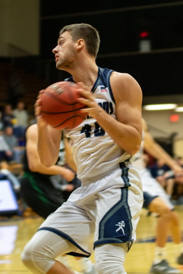 Going in: Senior forward David Salach drives to the hoop against Northeastern State. Salach tallied nine points for the Ichabods last Thursday. 