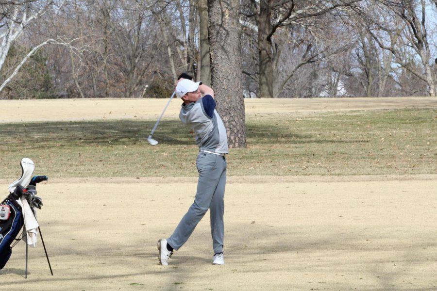 Follow+through%3A%C2%A0Freshman+Chase+Dillion+takes+a+shot+from+the+fairway+looking+to+hit+the+green.+Dillion+competed+as+an+individual+during+the+Washburn+Invite.