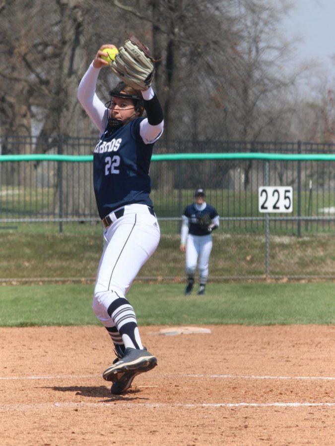 Whip+it%3A%C2%A0Senior+Raegan+Hamm+winds+up+and+delivers+the+pitch.+Hamm+threw+a+complete+game+shutout+in+game+one+of+the+doubleheader.