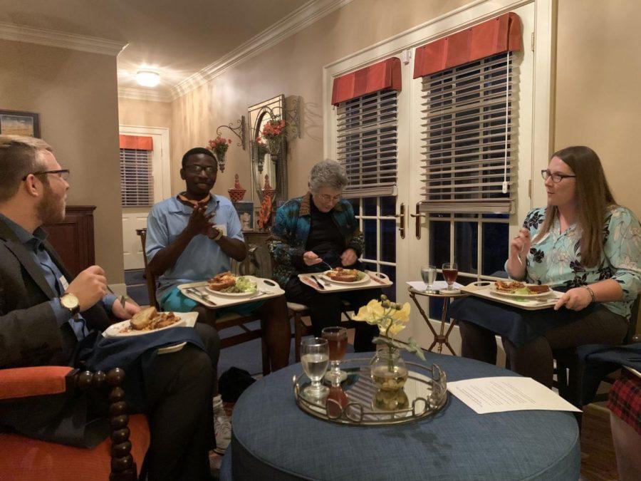 Dine and discuss: One of the three groups discusses questions that Susan Farley created. They enjoyed their meal while enjoying good conversation with their peers. 