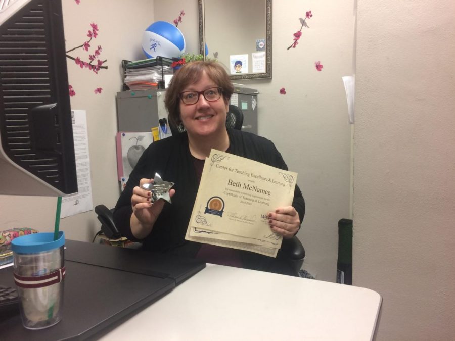 A learning opportunity: Mathematics & Statistics professor Beth McNamee poses with her C-TEL certificates. She was proud to display her achievements and discuss skills she has acquired by attending workshops. 