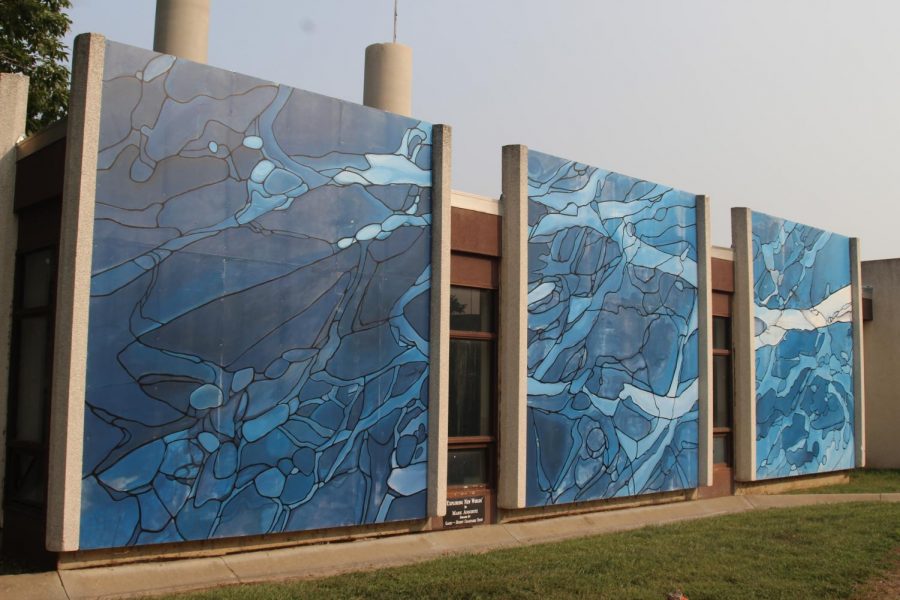 “Exploring New Worlds” is a mural that was created by Mark Anschutz. It is located near Yager Stadium.