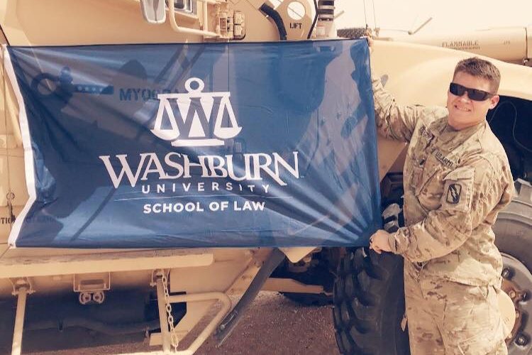 Silas Minkevitch took the Washburn Law Flag during his deployment to the Middle East.
