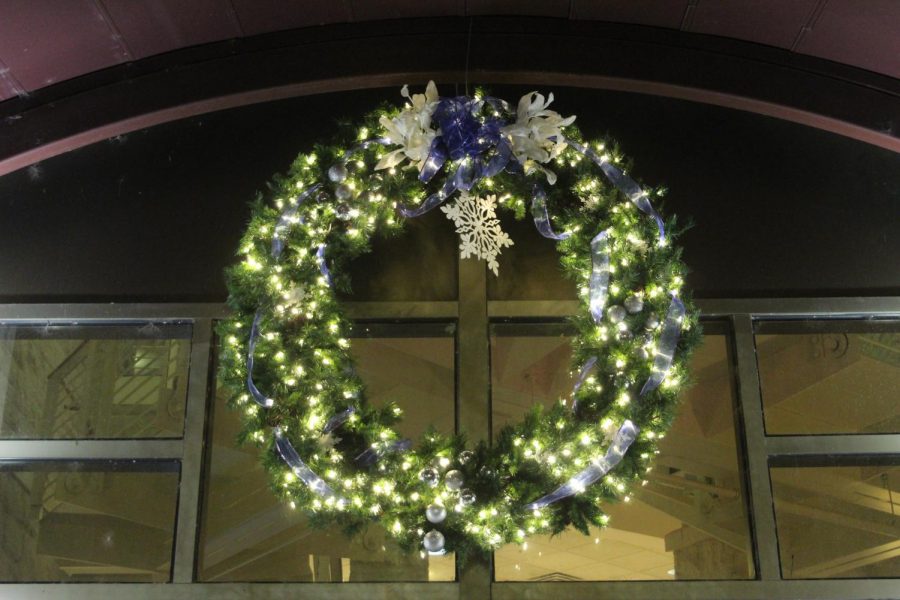 Blue+and+white%3A+This+large+holiday+wreath+decorates+the+entrance+to+the+dining+hall.+It+has+helped+add+an+element+of+Christmas+cheer+to+the+building.