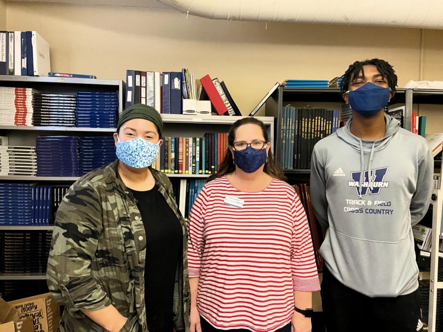 Need a mask? Dr. Debbie Isaacson standing with student media staff Anna-Marie Lauppe (left) and Eric Patterson (right). All three are wearing some of Dr. Isaacson's handmade masks.
