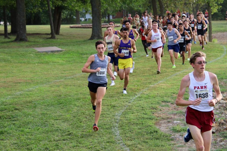 Leading the pack: Cooper Griffin leads the pack of runners around corner 8 on Sept. 24, 2021. Griffin finished 37th in the race, earning 31 points for the team.