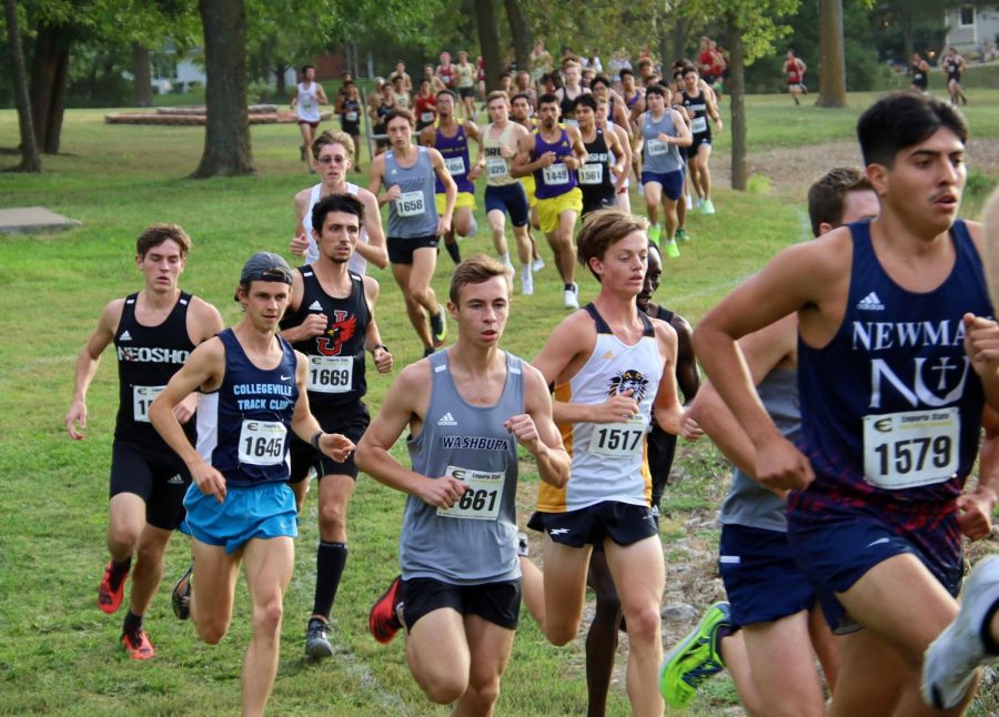 Before the masses: Nick Petrella runs ahead of the mass of runners that follow. Nick finished 42nd with a time of 28:12.5.