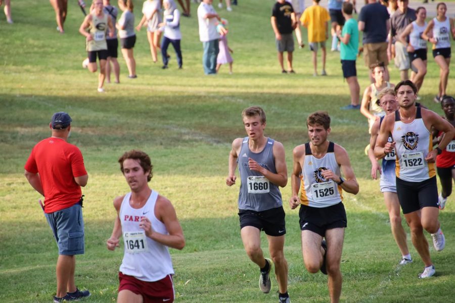 Friendly competition: Gustav Morch and a Fort Hays competitor fight to stay ahead of each other. Gustave Morch finished in 27th with a time of 27:39.7.