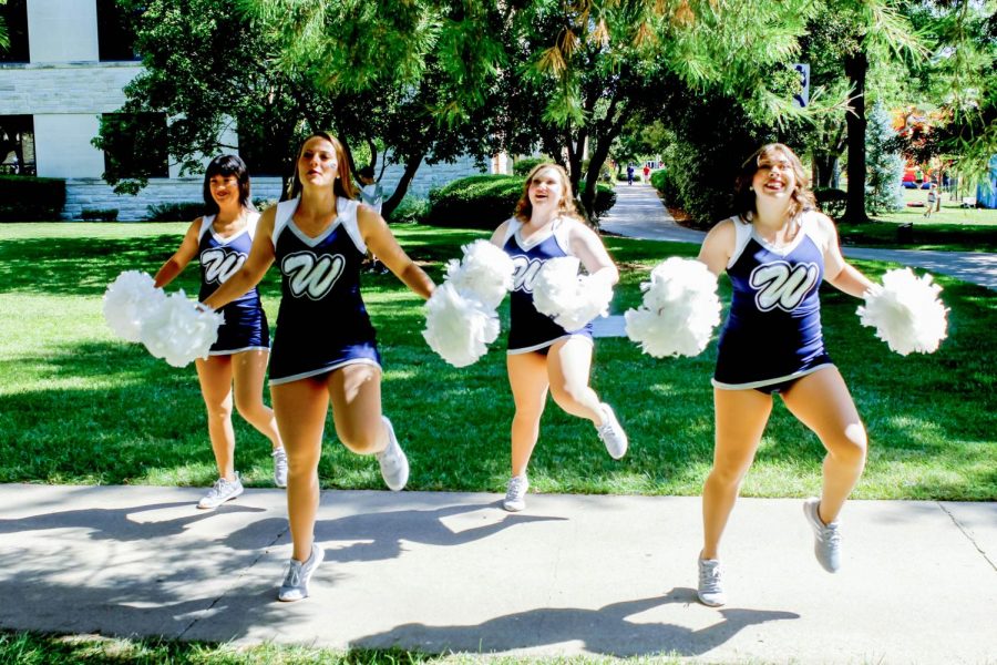 Groovy: Washburn University Dancing Blues practice their dance moves before the Family Day Football Game. Their enthusiasm brought joy to their families and the crowd.