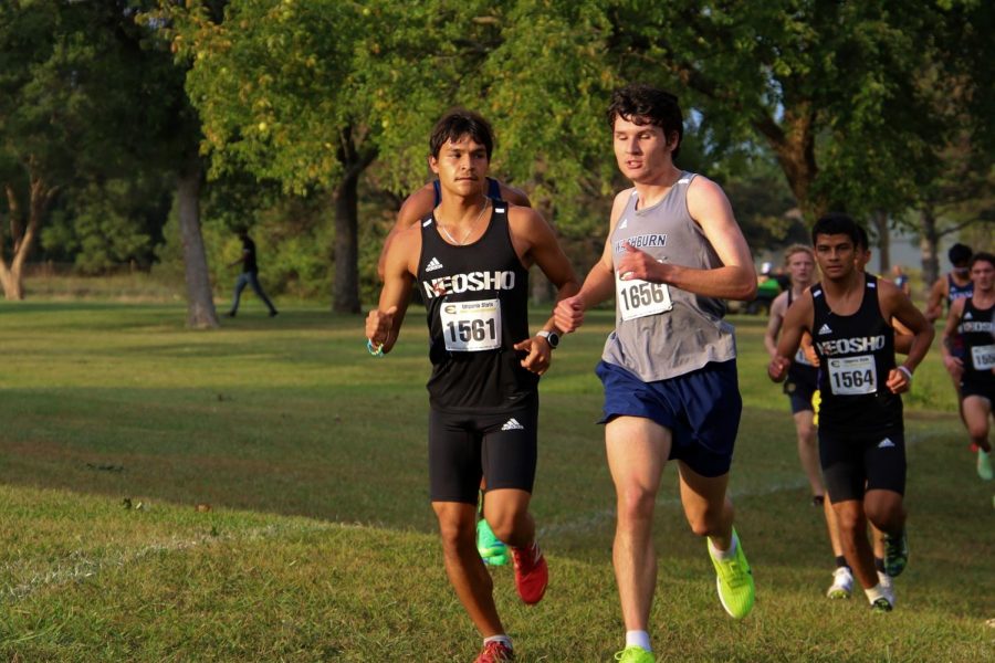 Another One: James Gillin surprises a competitor by overtaking them. Gillin finished with a time of 30:43.3 on Sept. 24, 2021.