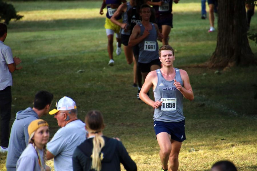 Running on: Brett Kulp continues to pick up the pace after running down a hill on Sept. 24, 2021. Kulp finished 31st out of 110 runners.