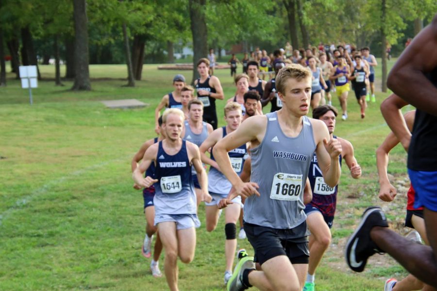 With the flow: Gustav Morch runs with the flow of the runners confidently moving up. Gustav finished first for the Ichabod's in 25th place.