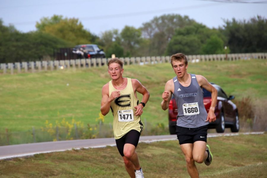 Up Hill Battle: Gutsav Morch and an Emporia runner fight an uphill battle to maintain their place. Gutav Morch finished in 25th place, earning 23 points for his team.