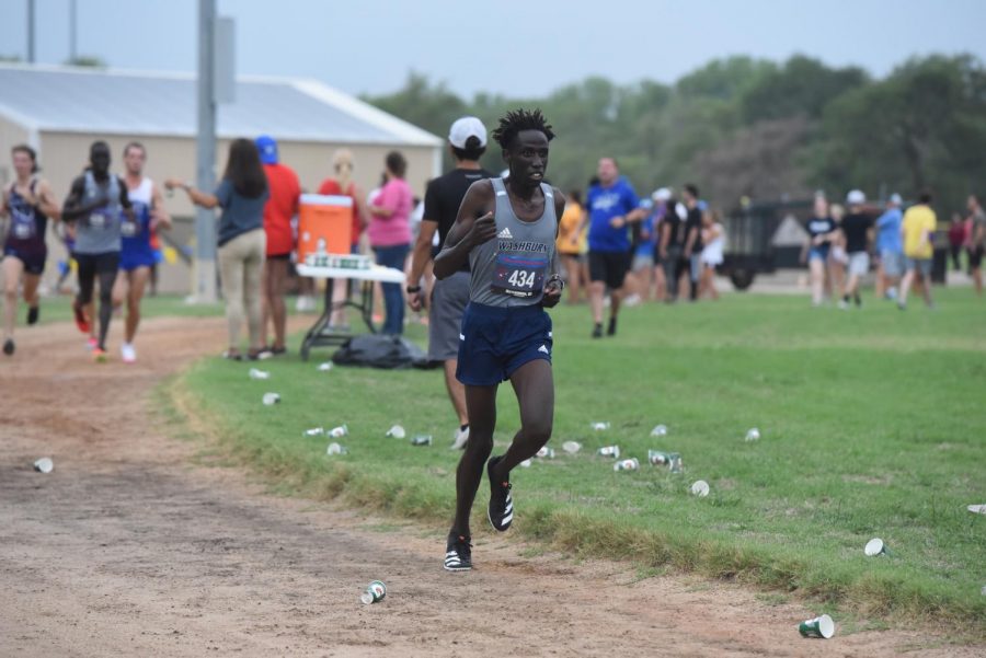 Run, run, run: Sophomore David Kibet runs on his way to finishing fifth in the four-mile race.