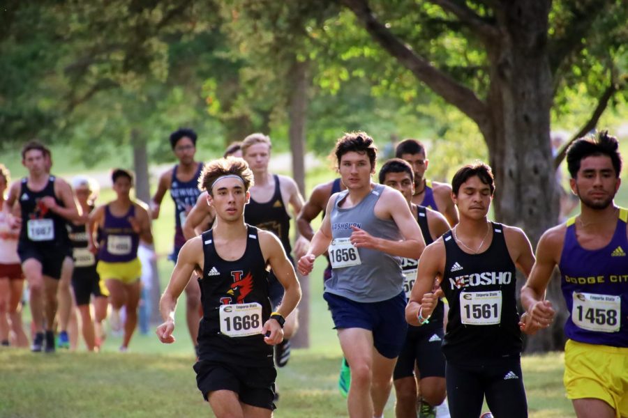 In the pack: James Gillin runs among a group of opponents, doing his best to maintain his position. Gillin added 52 points to Washburn's score on Sept. 24, 2021.